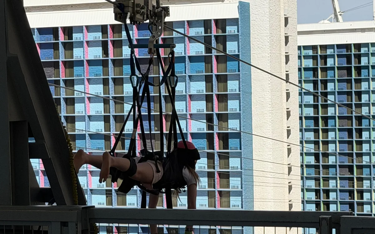 Zipline riders seen from the promenade below